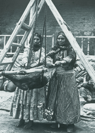 Ernest Hoeltzer , Nestorians butter-making in a goatskin Churn, Late 19th Century