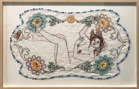 Embroidery of a nude woman with flowers around her