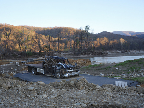 Black truck in a dried up river bed