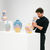 Guest at Hedy Yang's solo exhibition Of Moments & Memories with several cloud vases