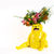 bright yellow dog vase by Katie Kimmel, full of flowers