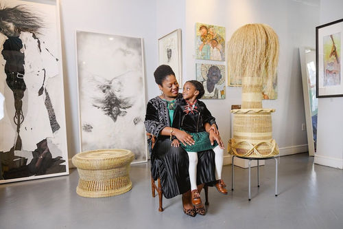 Portrait of Meisha Johnson, owner of Neema Gallery, with her daughter. Photo by Ruta Smith. Courtesy of Neema Gallery.