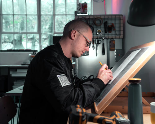 Portrait of the artist Penny inside his studio.