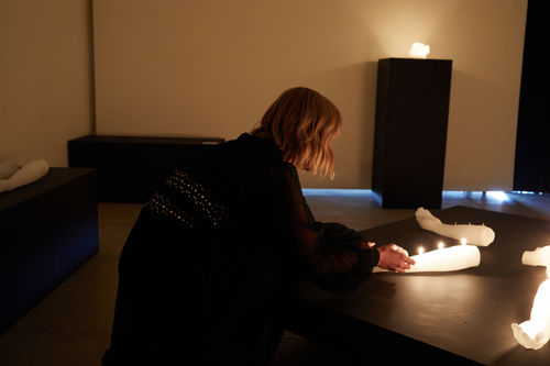 Thais Mather lighting the candles at form & concept.
