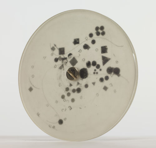 Mira Schendel Sem título [Untitled], da série [from the series] Discos [Discs], 1971 - 1973 acrílico opaco, letraset e parafusos [acrylic glass (opaque), transfer lettering (letraset), sccrew] ø 9 x 0.6 cm [ø 3 1/2 x 1/4 in]