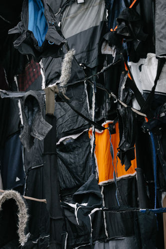 Marcin Dudek, Inspire.People.Motion., 2020, Used textiles, thread, wood, steel, video monitor. Detail. Photo: Damon De Backer.