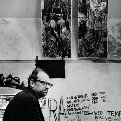 John Bratby photographed alongside his works in black and white