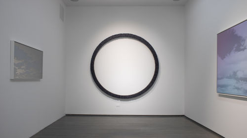 Manish Nai, Untitled, 2019. Compressed natural indigo jute cloth and wood. 30 total pillars Variable arrangements and poles 80 x 3 x 3 inches.