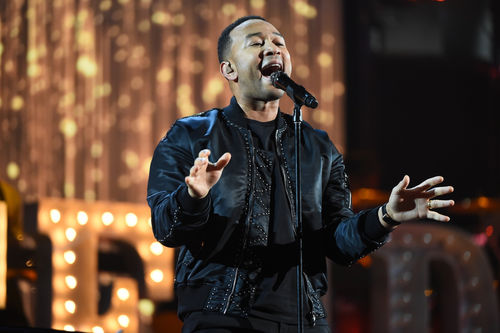 John Legend and Jessie Williams are co-producing 'With Drawn Arms,' a documentary about Olympian Tommie Smith. Andrew D. Bernstein/Getty