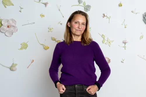Monica Banks standing in front of one of her ceramic installations.