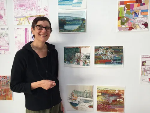 Josette Urso with several of her paintings.
