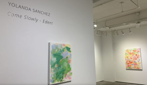 Two abstract floral paintings on gallery wall