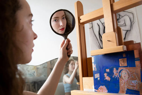 Natasha Walsh with her nearly completed Archibald Prize entry, a riff on Brett Whiteley’s winning piece, ‘Self-portrait in the studio’.