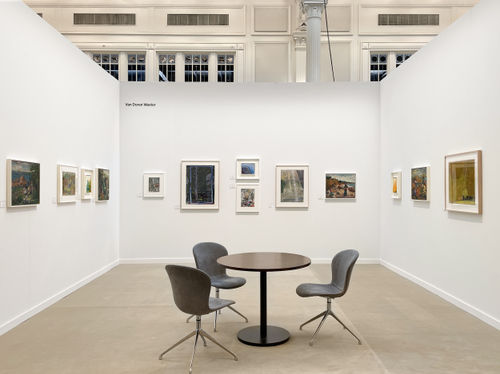 art fair booth with various framed artworks on the wall