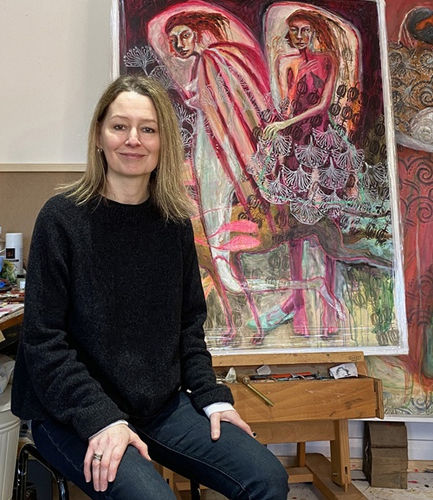 Rebecca Swainston in her studio with her piece 'smokers' propped up in the background.
