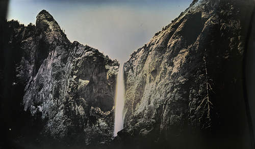 A waterfall is photographed as a daguerreotype 
