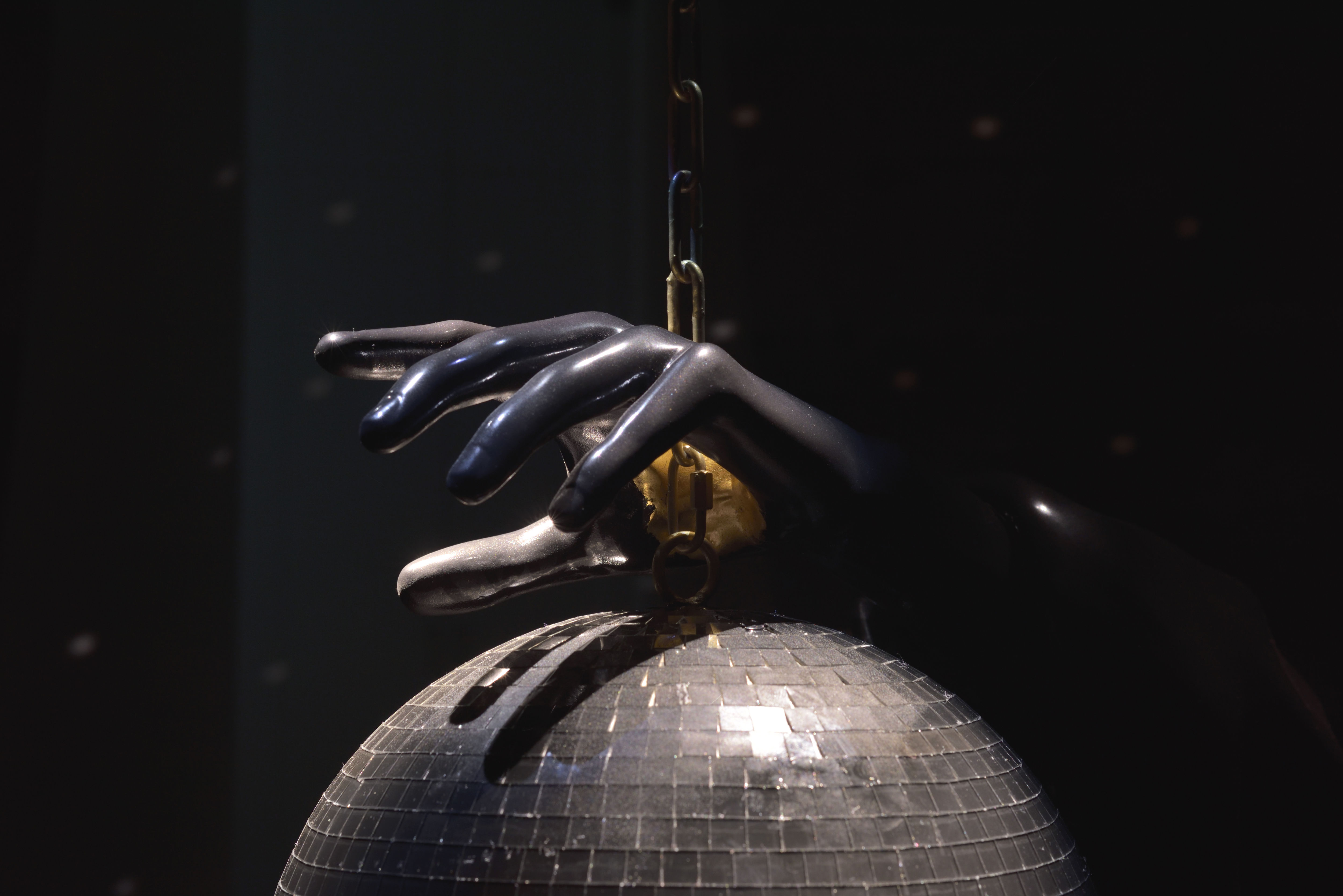 installation view of Glory Hole, 2025 by Gerard & Kelly: Bardo at Marian Goodman Gallery Paris; sculpture made of Polyester resin cast, automobile paint, gold leaf; disco ball, chain, motor