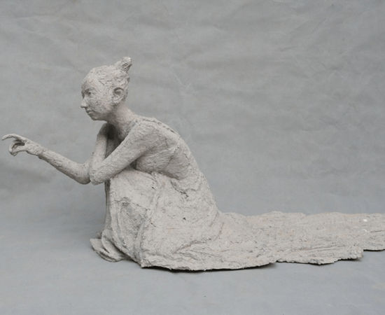 A girl scratches the wall. 