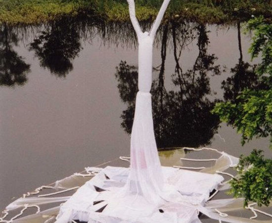 The installation of white theatrical sleeves is hovering on the surface of river