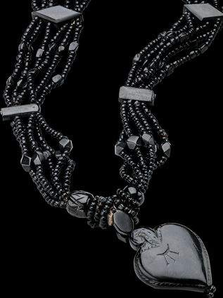 Worn by abbesses along the pilgrimage route, often from noble families, the two collars are made of carved jet beads that are faceted in diamond, octagonal, rectangular and “S” shapes and polished.