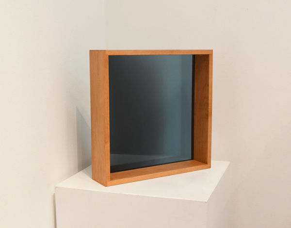 glass cube by Larry Bell