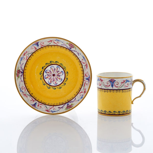 Sèvres Porcelain, A Soft-Paste Sèvres Porcelain Yellow Ground Cup and Saucer, 1789