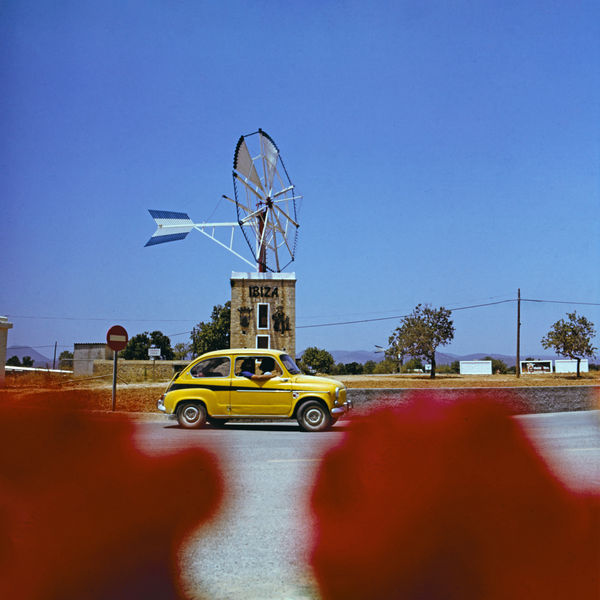 Walter Rudolph, Yellow Fiat 600 on a roundabout, Ibiza, Spain, 1976