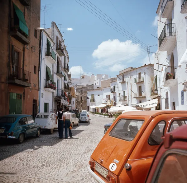 Walter Rudolph When Cars Had Priority, Plaça de Vila, Ibiza, 1976 Signed, Numbered and accompanied with a Certificate of Authenticity C-Type Print on Hahnemühle Photo Rag Baryta 310grs 19 3/4 x 19 3/4 in 50 x 50 cm 23 5/8 x 23 5/8 in 60 x 60 cm Edition of 10 plus 2 artist's proofs (Edition record)