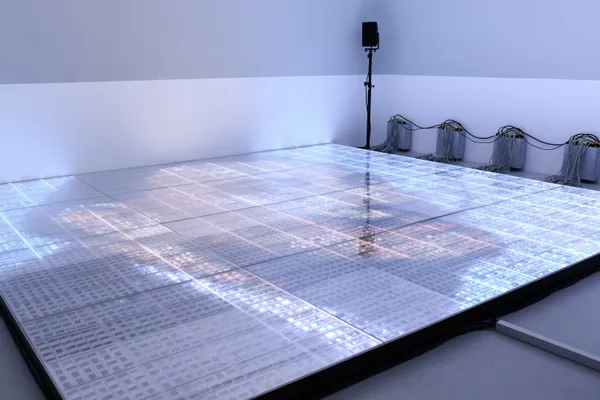 Philipp Goldbach Dance Floor, 2021 walk-on dance floor of 7680 art history slides, 16 modules, each 107 x 110.8 cm, consisting of 20 Journal-24 cassettes, LEDs, subcontrollers, WLAN master controller, audio system of 4 stereo boxes, subwoofer, amplifier 428.0 x 443.2 cm total area