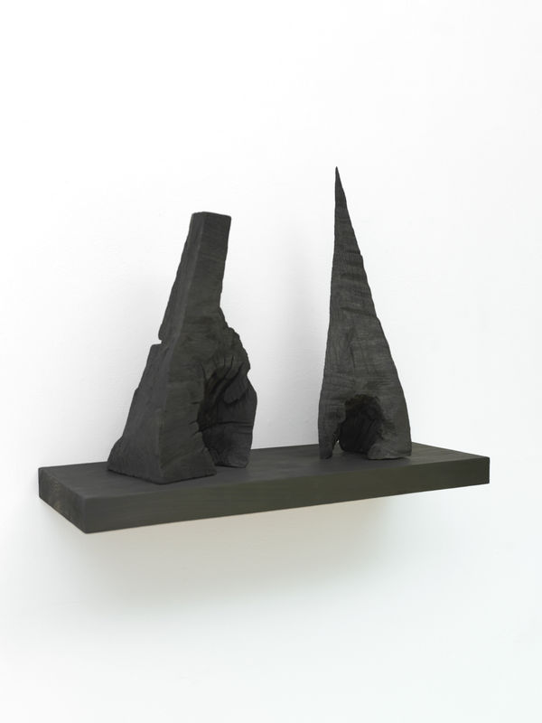 David Nash Two Caves, 2020 charred Oak forms on charred Tulip shelf 55 x 70 x 27 cm