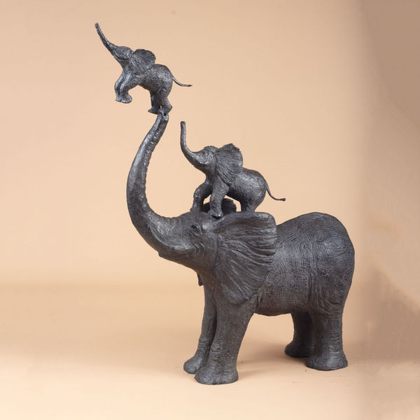 Each in its turn elephant sculpture of Sophie Verger contemporary sculpture animal sculpture bronze sculpture art a mother elephant play with her two little elephant kids on her trunk and try to catch up the sky and play in circus garden sculpture interior design at Art Yi Brussels art gallery