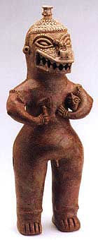 Sculpture of a Standing Saurian Deity Holding an Axe and a Head