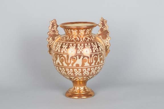 Copper lustre glazed terracotta globular vase