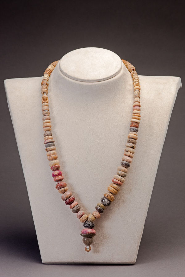 Necklace composed of large carved beads ofvarious periods