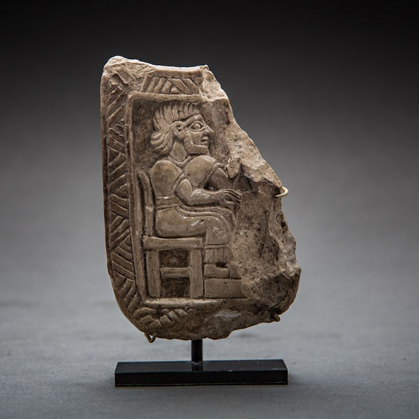 Babylonian Stone Relief Sculpture Depicting a Seated Figure