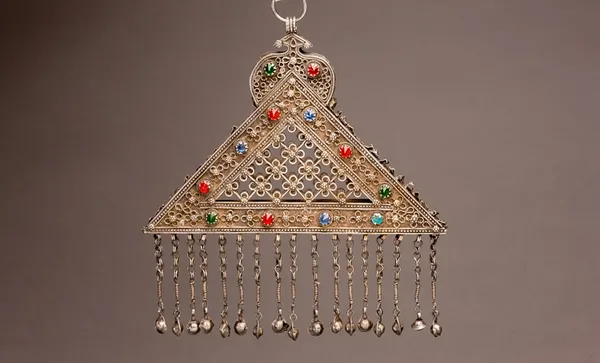 Triangular perforated Turkoman silver and carnelian chest pendant