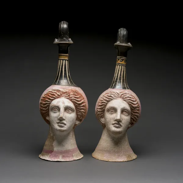 Pair of Canosan Vases in the Form of a Woman's Head