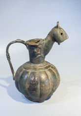 Bronze globular jug with feline-head spout