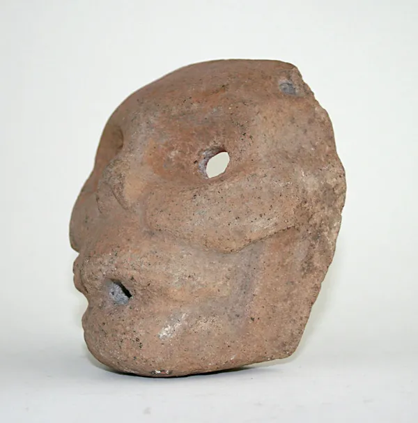 Mayan Basalt Mask Depicting A Jaguar Face