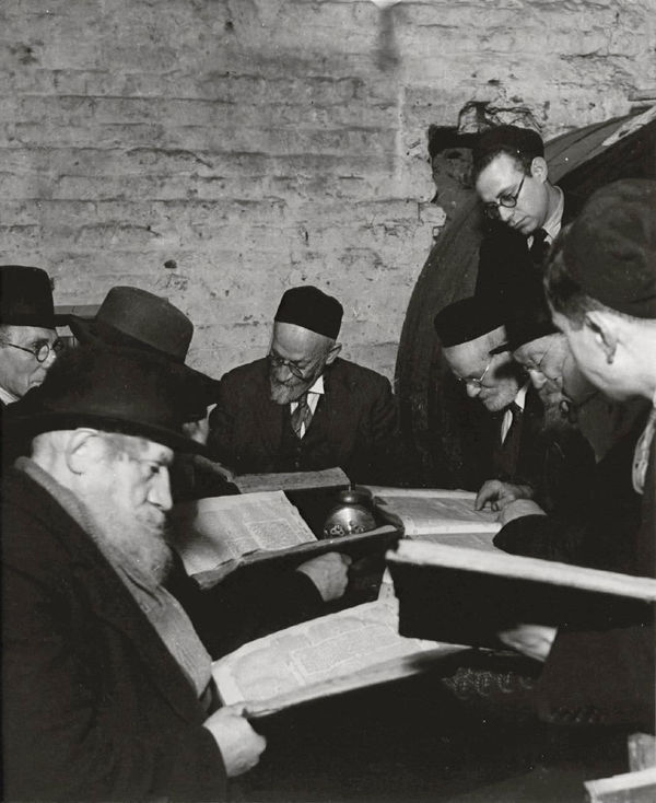 Bill Brandt, East End Wine Merchant's Cellar: A Group of Orthodox Jews reading their Bibles, 1940