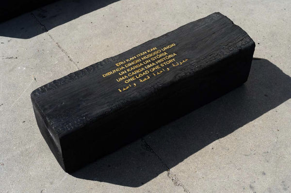 Grada Kilomba Untitled Poem (one load one story), 2022 Charcoal log with gold leaf engraving 11 3/4 x 11 3/4 x 35 3/8 inches 30 x 30 x 90 cm