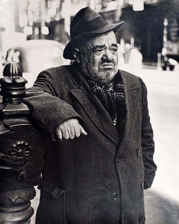 Lower East Side, New York (Dwarf leaning on railing)