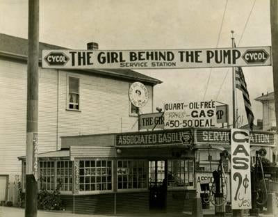 E.O. Hoppe Gas Station, 'The Girl Behind the Pump', Los Angeles CA, 1926 Vintage gelatin silver print 7 x 9 in. 17.78 x 22.86 x 0.0 cm
