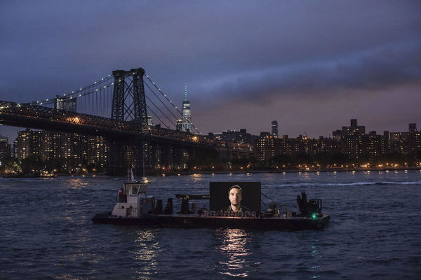 Shimon Attie, Night Watch (Sergey with Bridge), 20' wide LED screen on barge, Hudson River, 2019