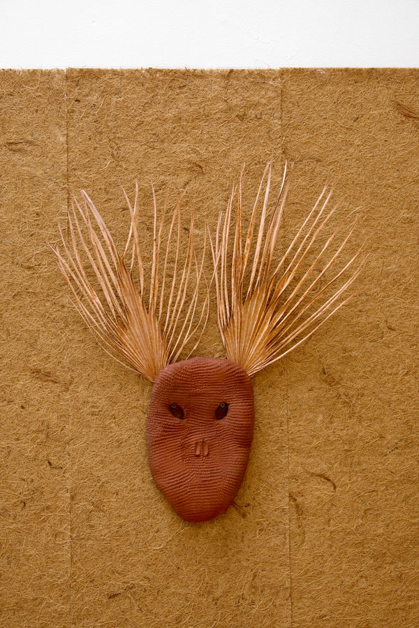 Lucía Pizzani Roja Palmas, 2024 Red stoneware clay and dried treated palm leaves 66 x 20 x 3.5 cm 26 x 7 7/8 x 1 3/8 in