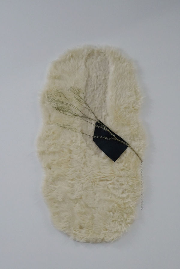 Anna McMahon Untitled #4 (from the series Holding my breath), 2018 faux fur wool rug, dried baby's breath, chain link, leather 120 x 80 cm