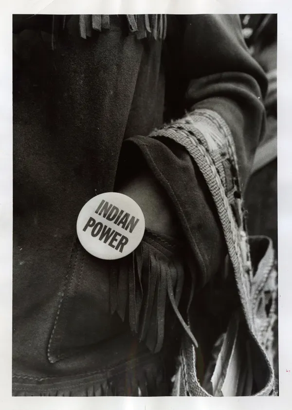 Quentin C. Doit, Press Photo Showing "Indian Power" Button, 1973