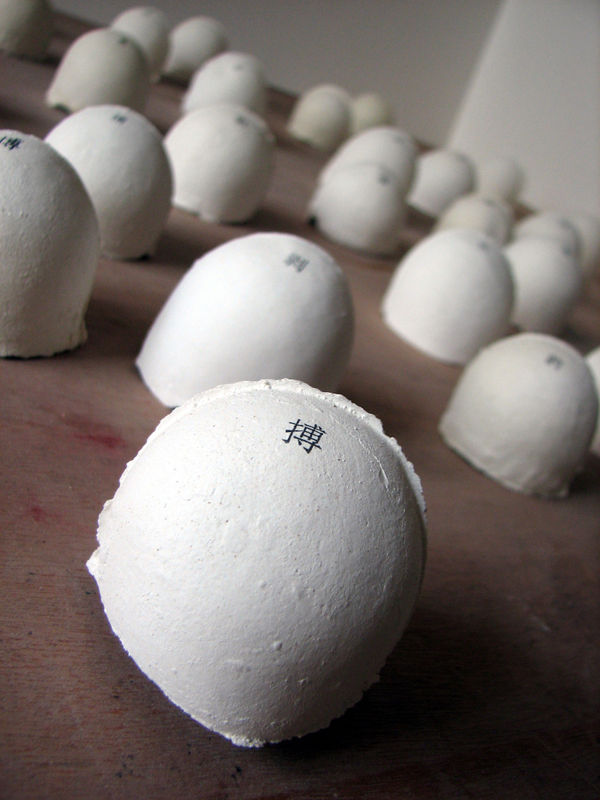 LIU Ren 刘任 100 Notes 100个信息, 2008-2009 Earthenware, sign pen, paper, 502 glue, slightly bigger than an eggshell 陶，签字笔，纸，502胶水，略大于一般蛋壳100个