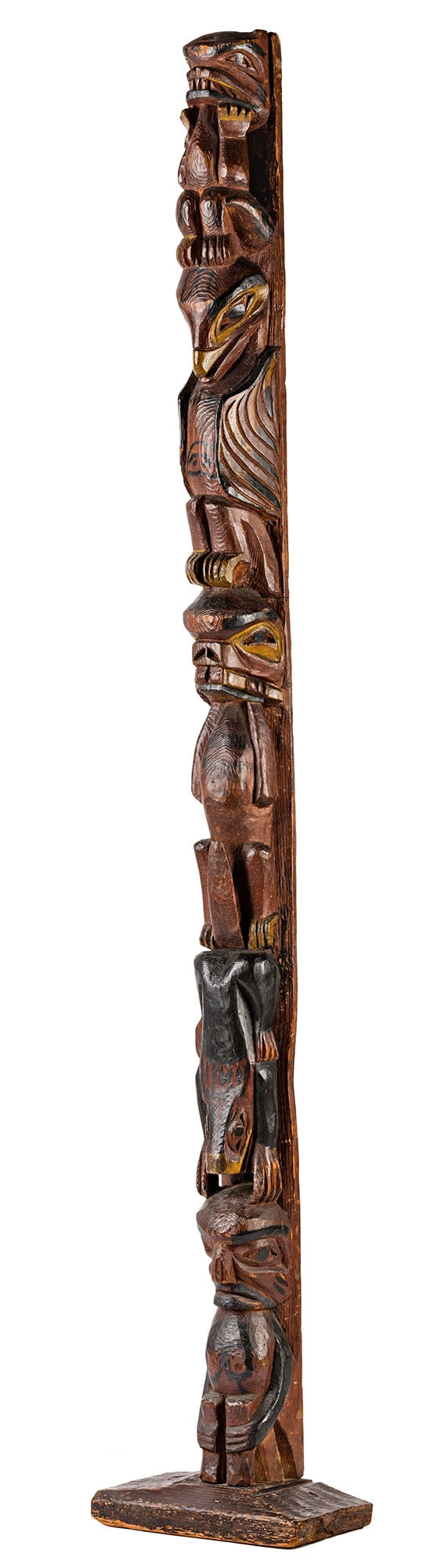Lot 53 UNIDENTIFIED ARTIST, POSSIBLY TLINGIT OR TSIMSHIAN Model Totem Pole, c. 1920s wood and pigment, 49 x 8 x 4.75 in (124.5 x 20.3 x 12.1 cm) ESTIMATE: $4,000 — $6,000 PRICE REALIZED: $4,320.00