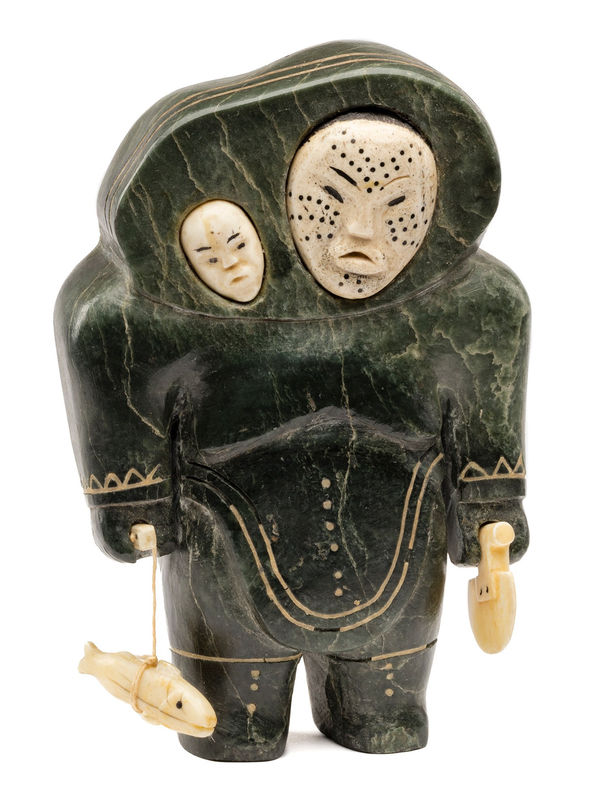 Lot 76 UNIDENTIFIED ARTIST, INUKJUAK (PORT HARRISON) Mother and Child, with Fish and Ulu, c. 1953 stone, bone, ivory, black inlay, soap inlay, and thread, 7.25 x 4.5 x 3 in (18.4 x 11.4 x 7.6 cm) ESTIMATE: $12,000 — $18,000 PRICE REALIZED: $28,800.00